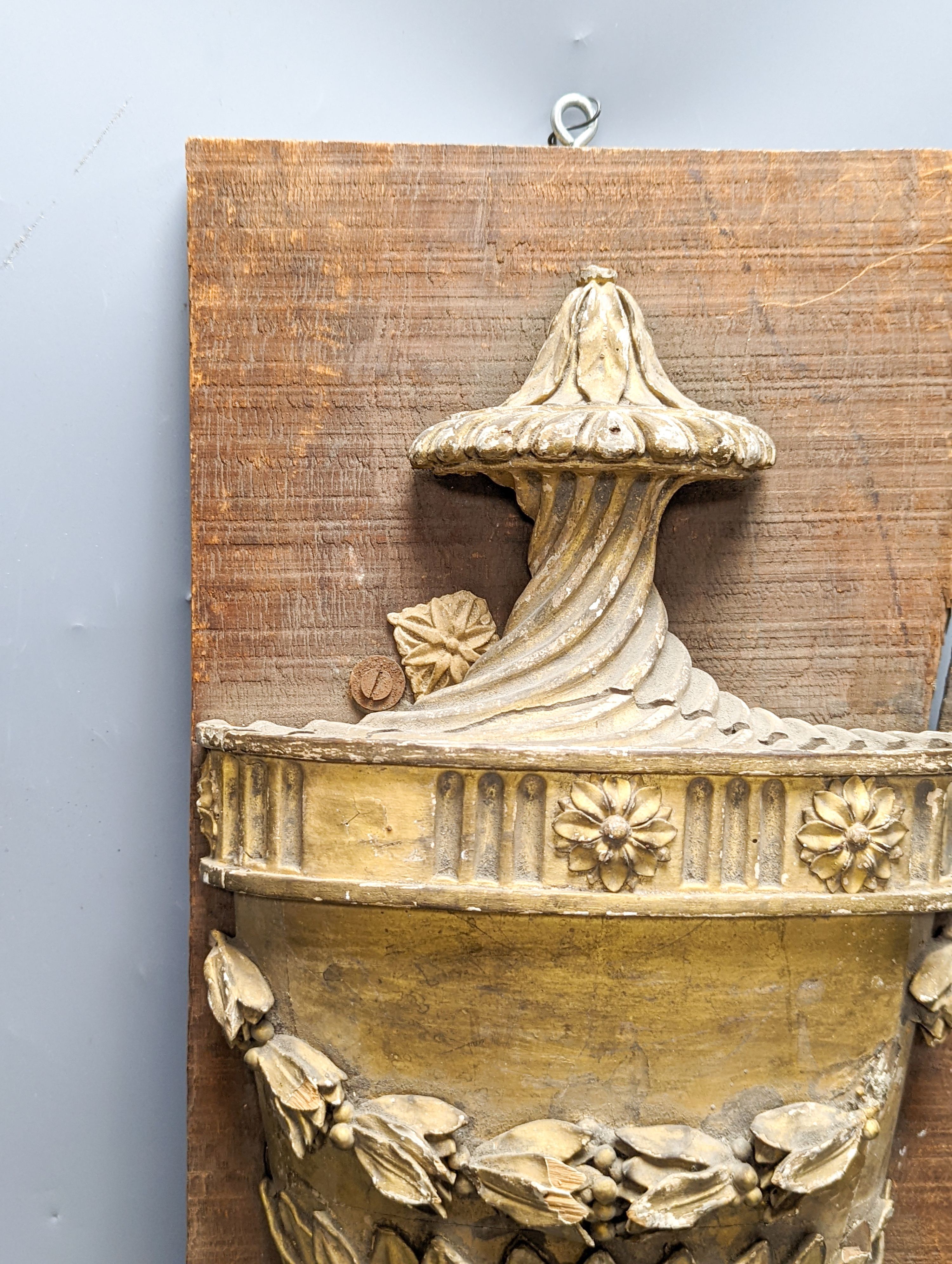 An 18th/19th century carved wood and gilt gesso urn relief, later mounted, 57x23cm